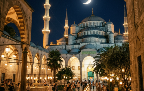 Blue Mosque courtyard at night with illuminated arches, minarets, and crescent moon